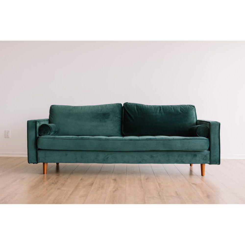 Three-seat fabric sofa in a bright room