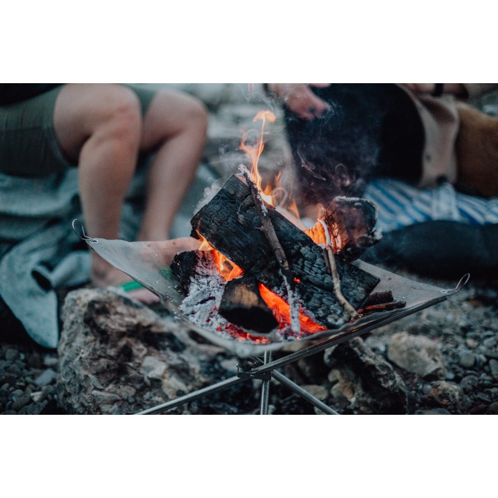 Corten steel garden fire pit burning